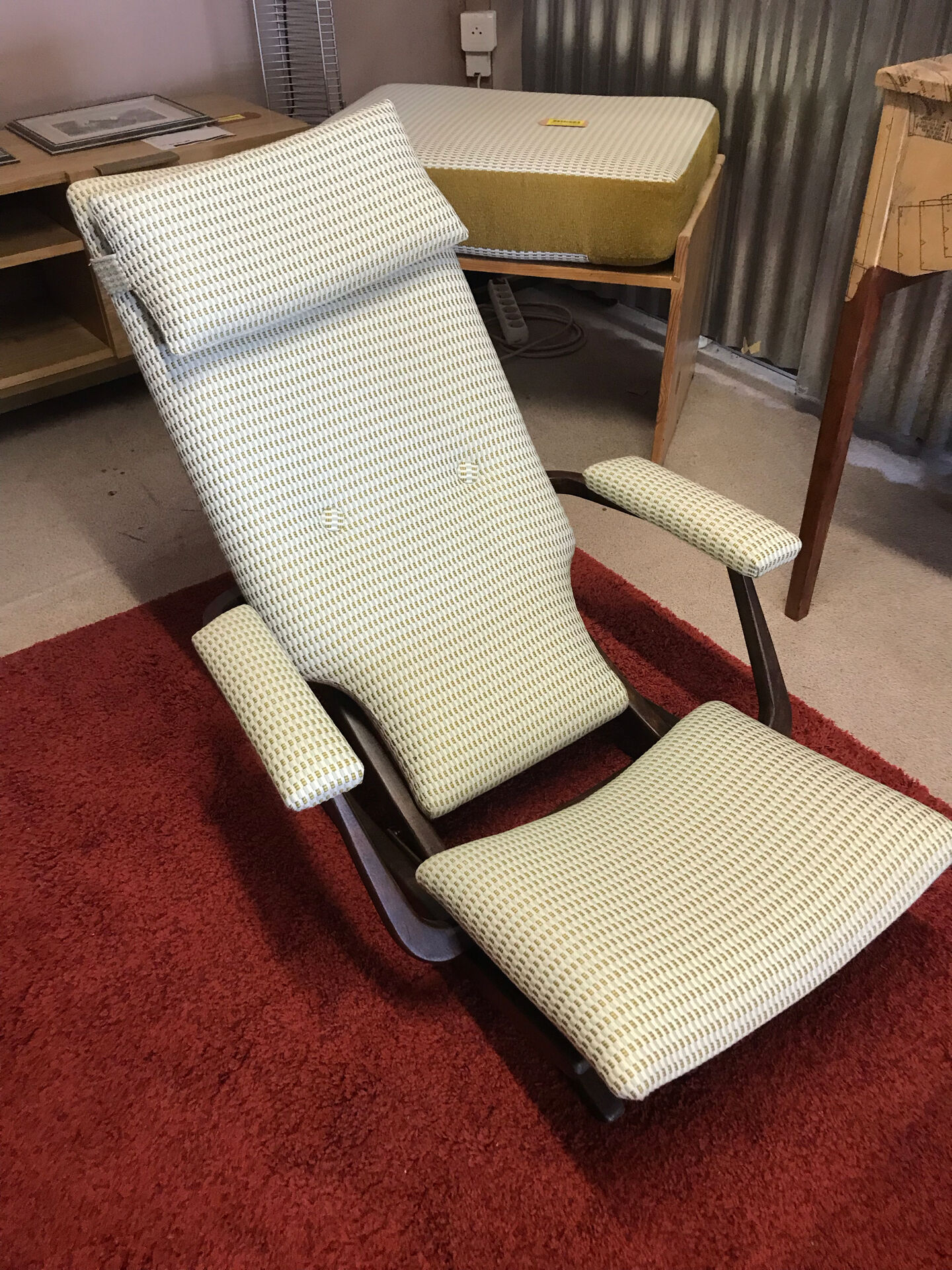Rocking lounge chair made of fabric suitable for outdoor use.