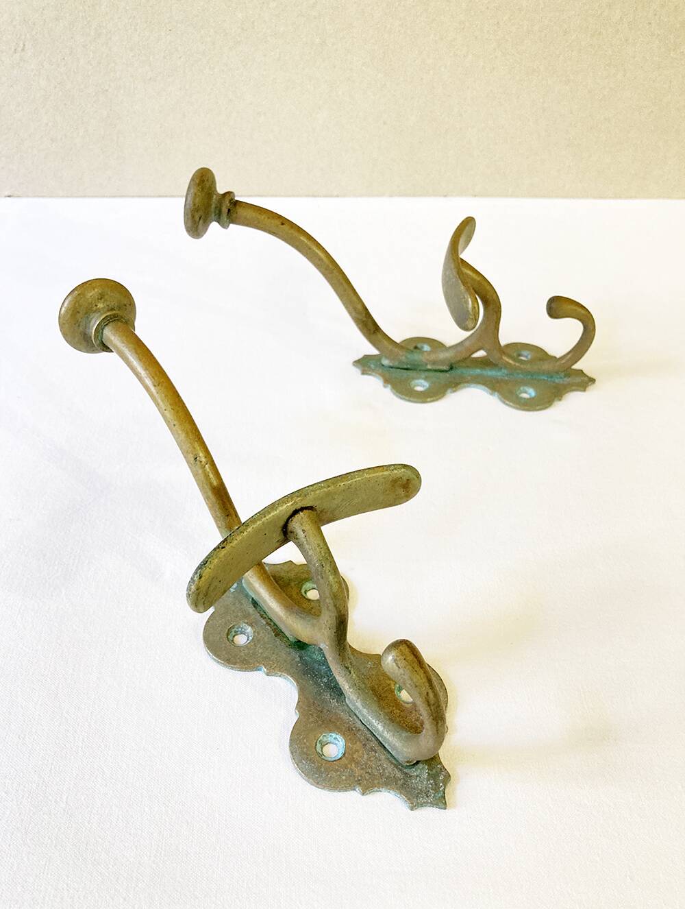 Antique patinated brass coat hooks