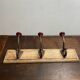 Wall hook with three hooks in wood, wrought iron, porcelain balls