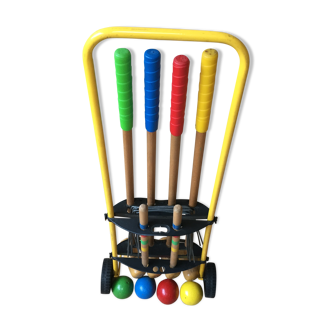 Ancient wooden croquet game in his wheeled cart