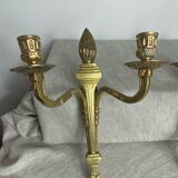 Deux bougeoirs muraux en bronze style Empire