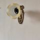 Antique wall light in gilded brass and glass tulip