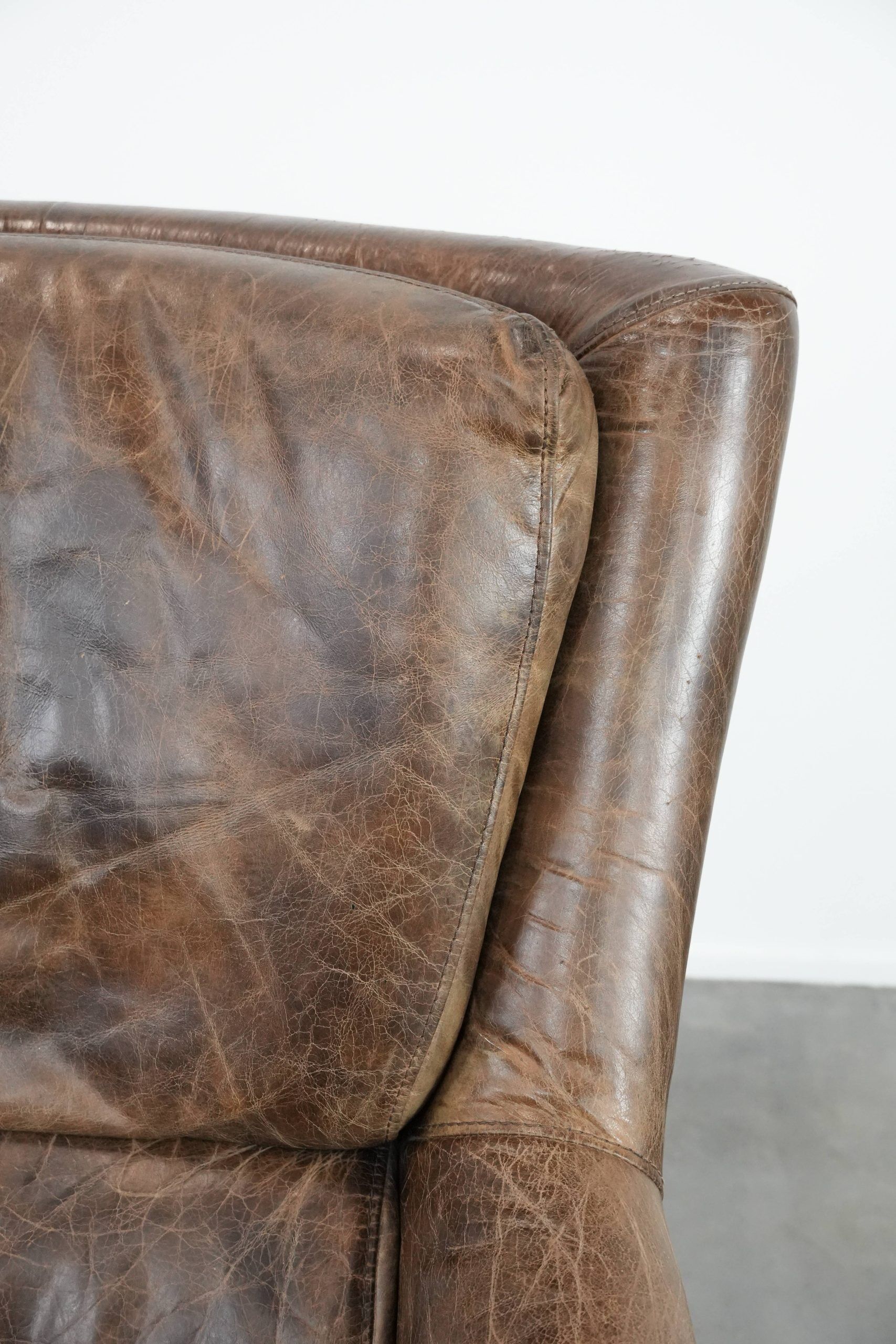 Very comfortable vintage cow leather armchair with beautiful colours