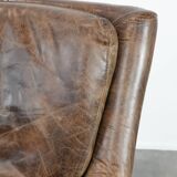 Very comfortable vintage cow leather armchair with beautiful colours