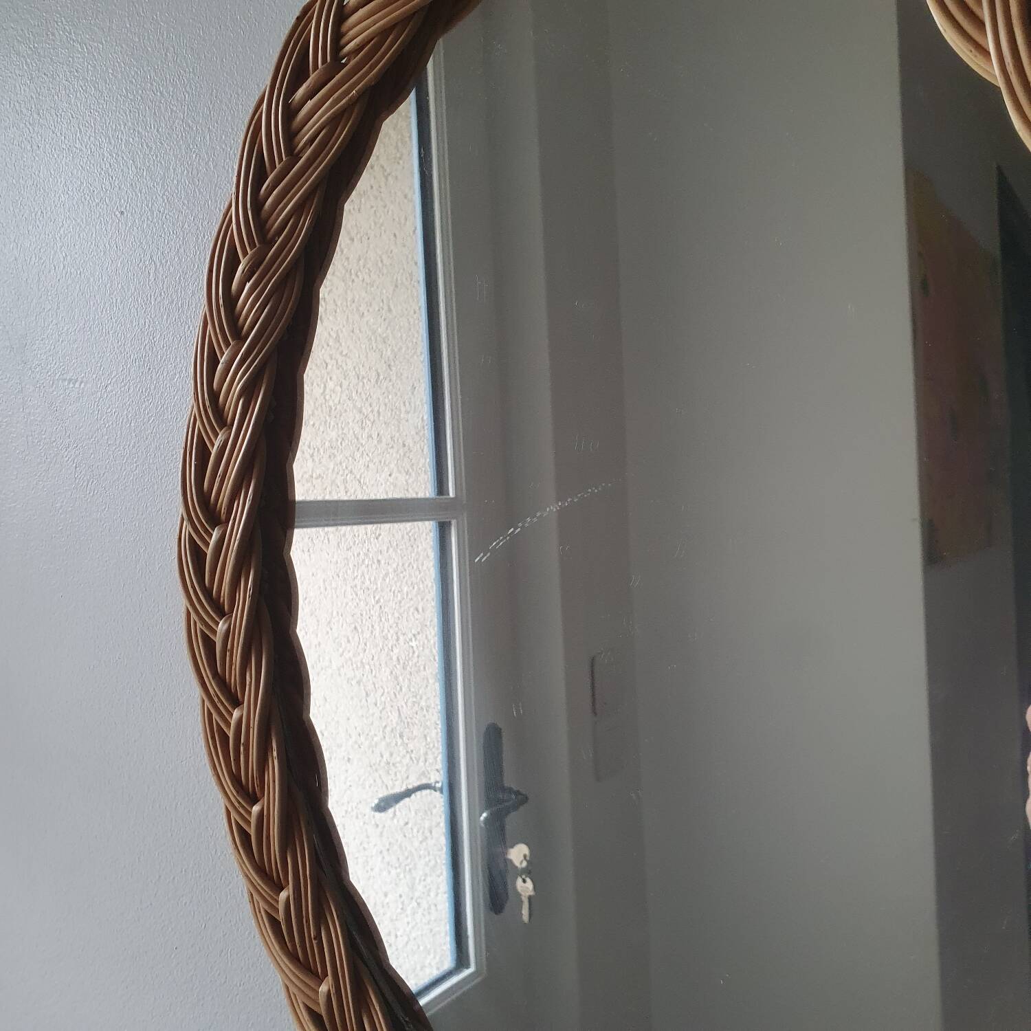 Vintage oval wicker mirror