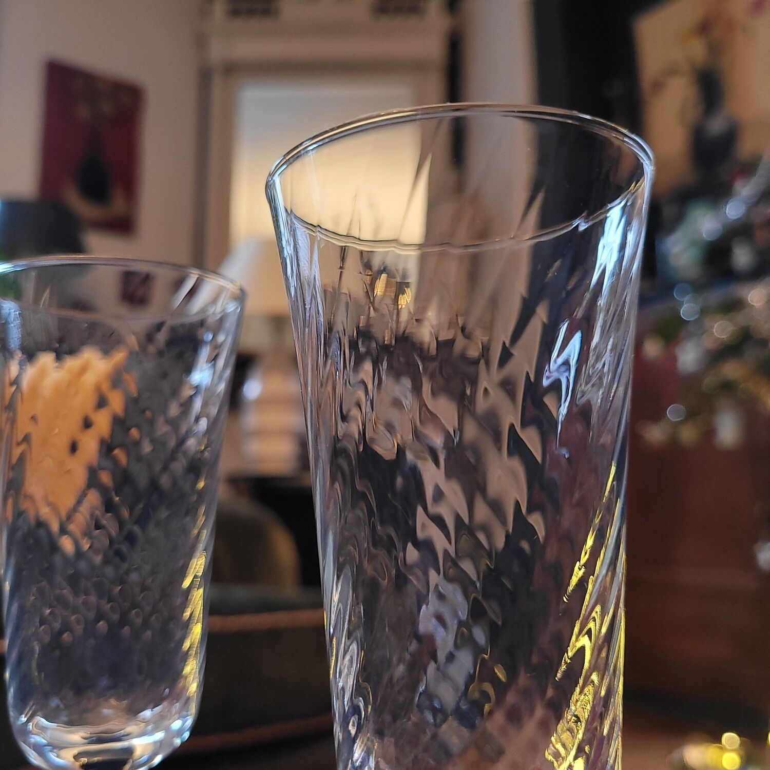 4 clear glass flutes with black stems. 1960–1970. 4 clear glass flutes with black stems.