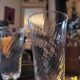 4 clear glass flutes with black stems. 1960–1970. 4 clear glass flutes with black stems.