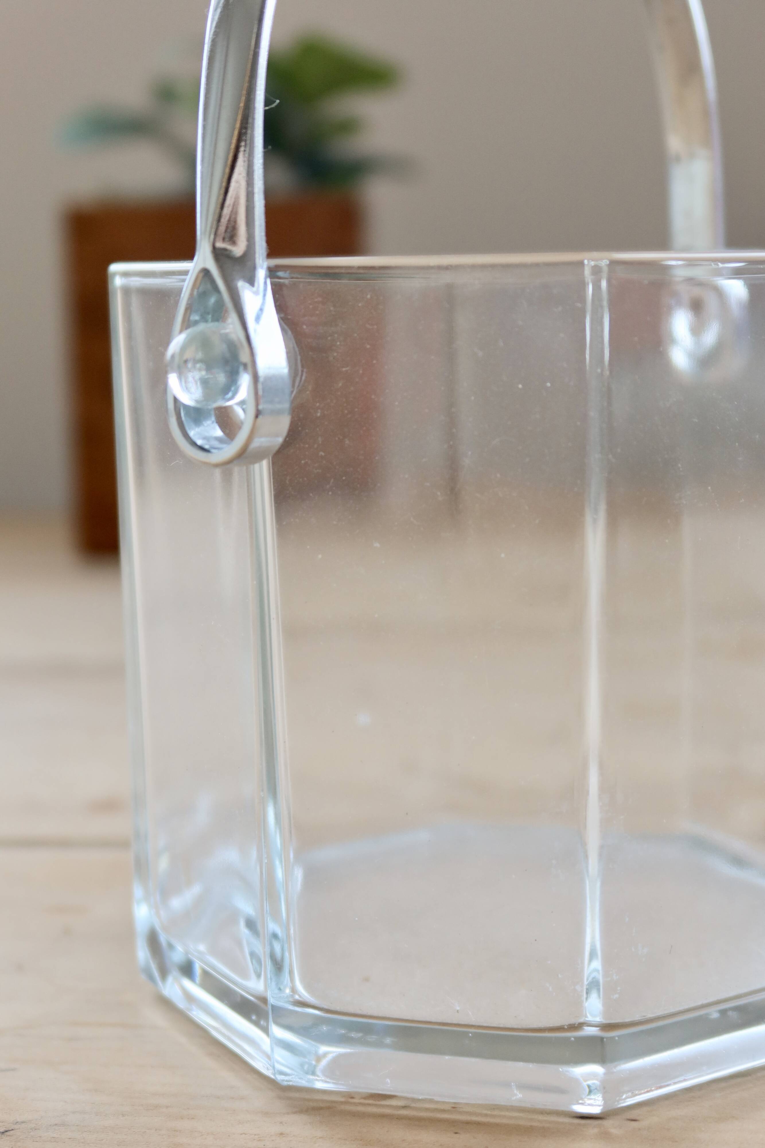 Vintage glass ice bucket with chrome handle.