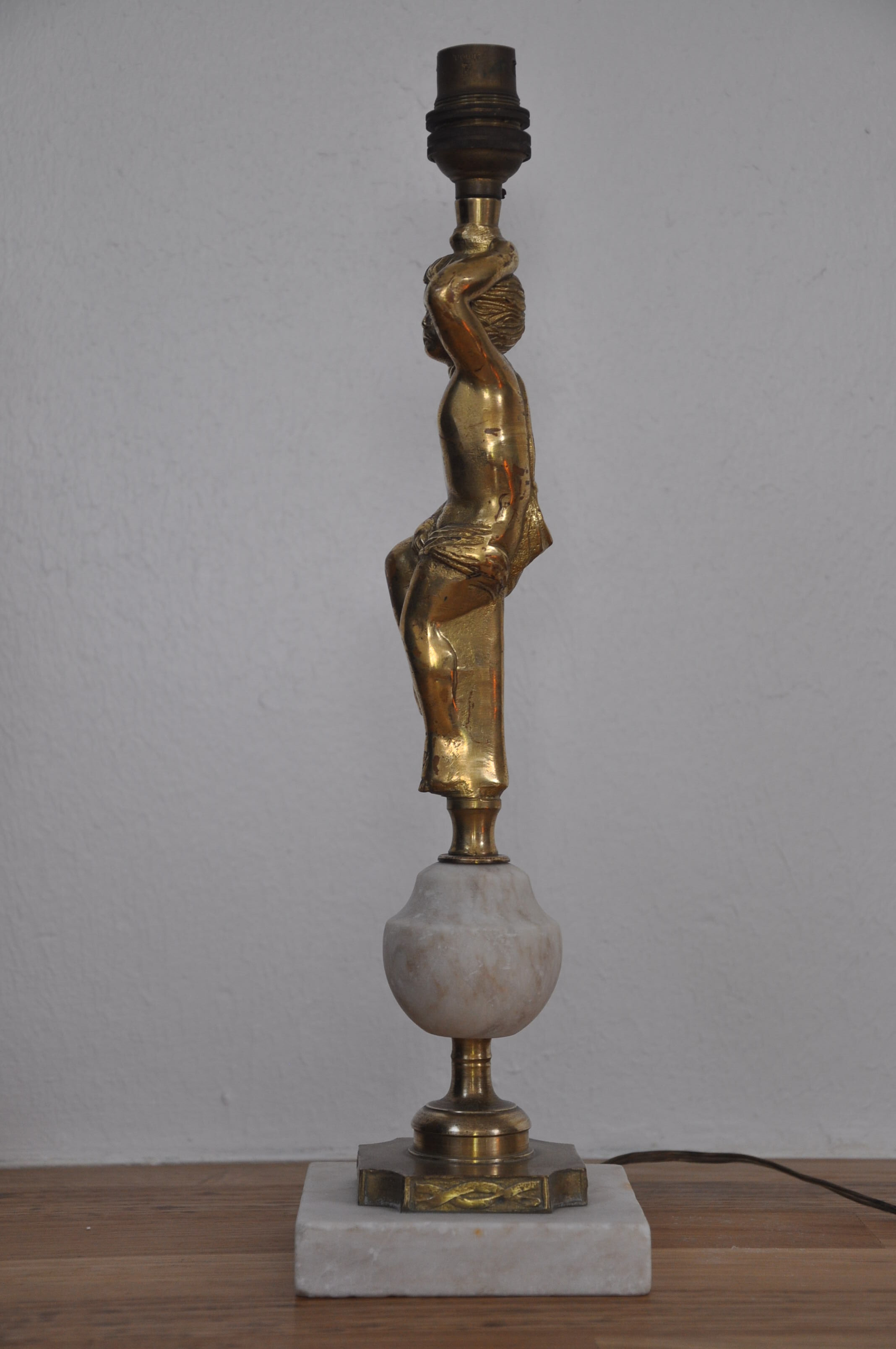Ancient alabaster lamp and bronze cherub decoration