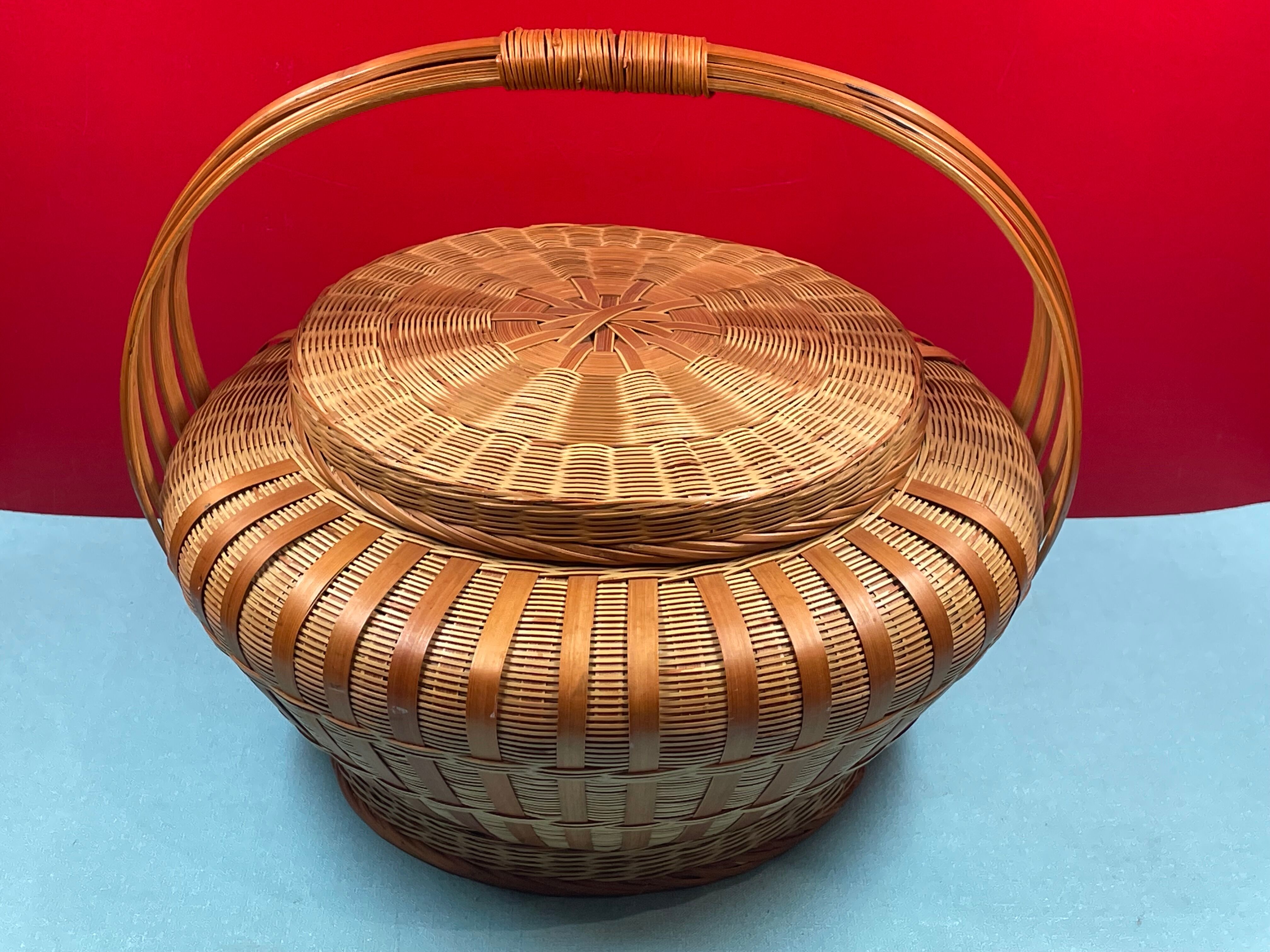 Worker vintage wicker covered basket