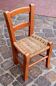 Small chair for children, folk art, wood and straw.