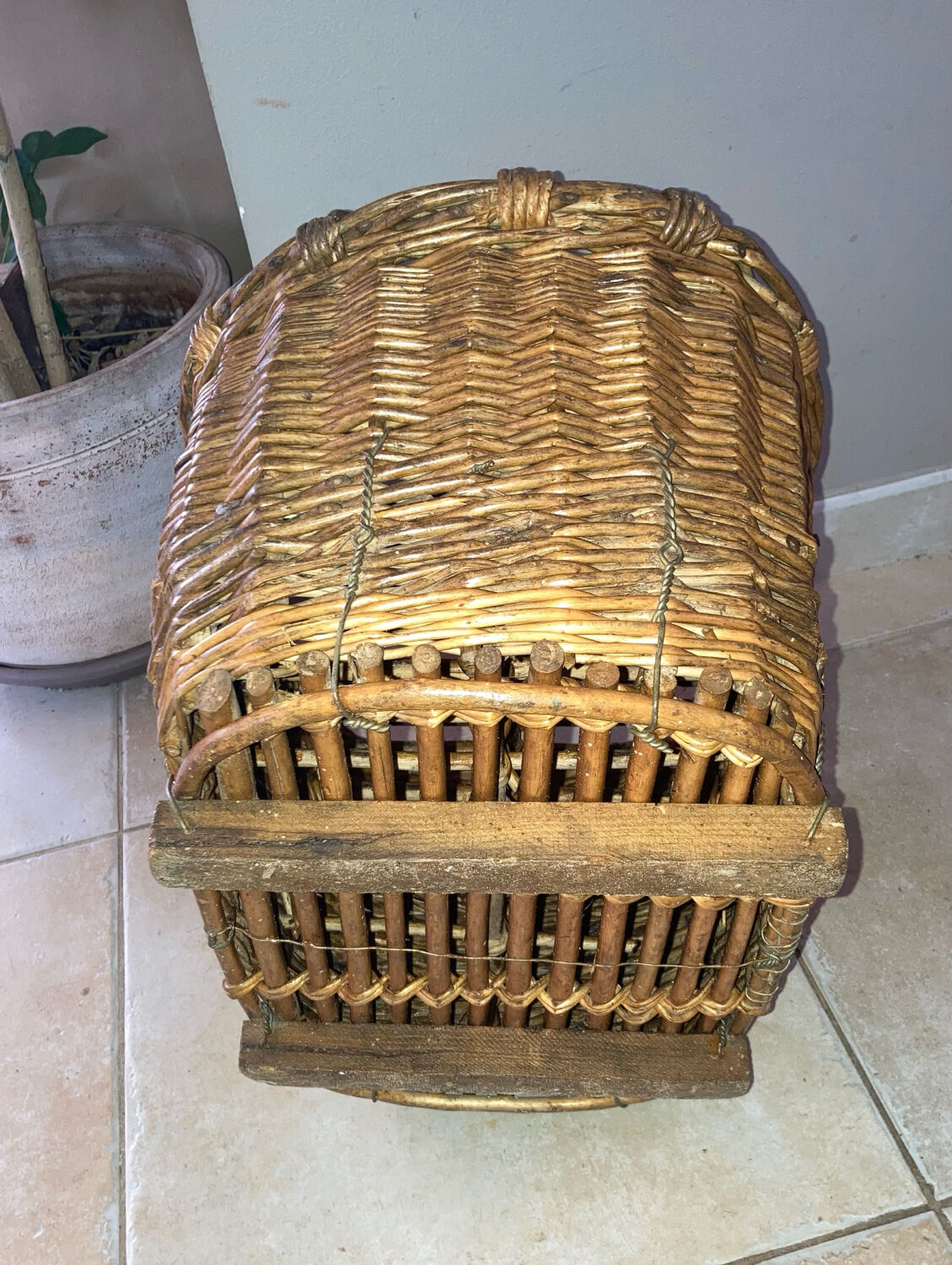 Wicker and hazel bottle basket from the early 20th century or possibly earlier.