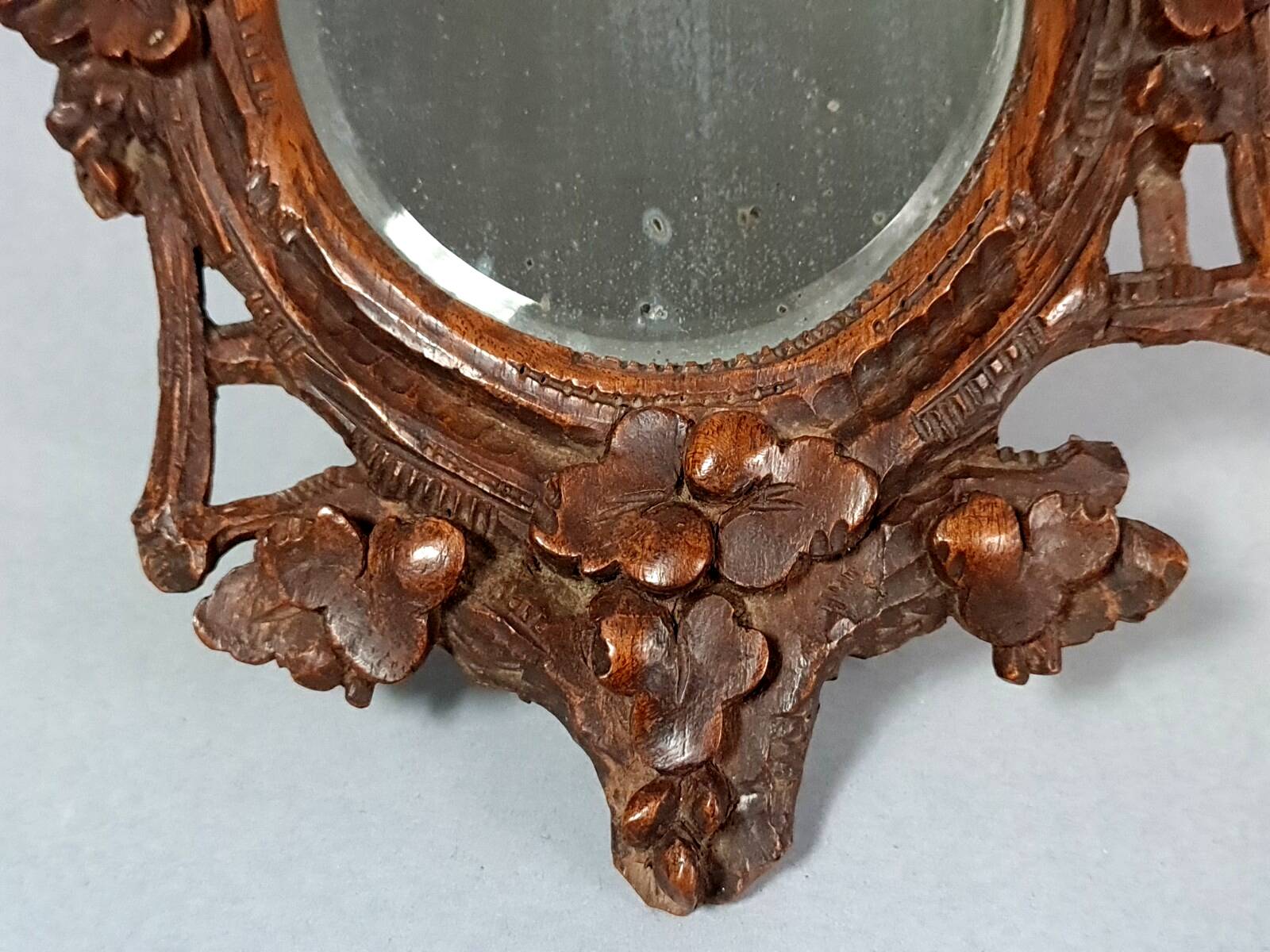 Antique small beveled mirror with carved wooden frame and waxed patina C714