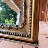 Large 19th century mirror gilded with gold leaf