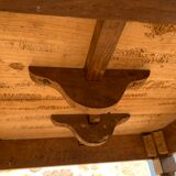 Round console table with folding shutters on copper wheels