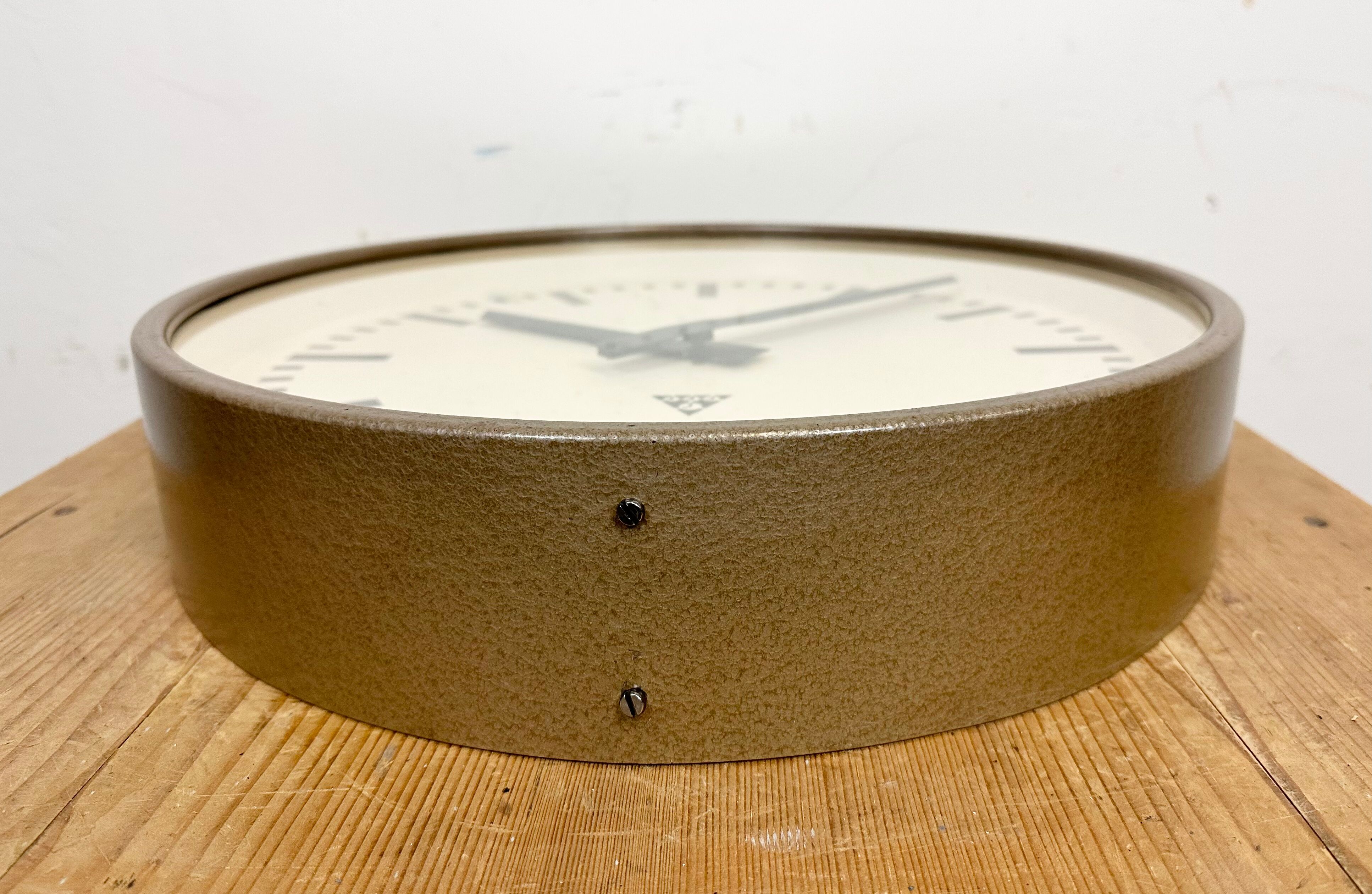Brown industrial factory wall clock from Pragotron, 1960s