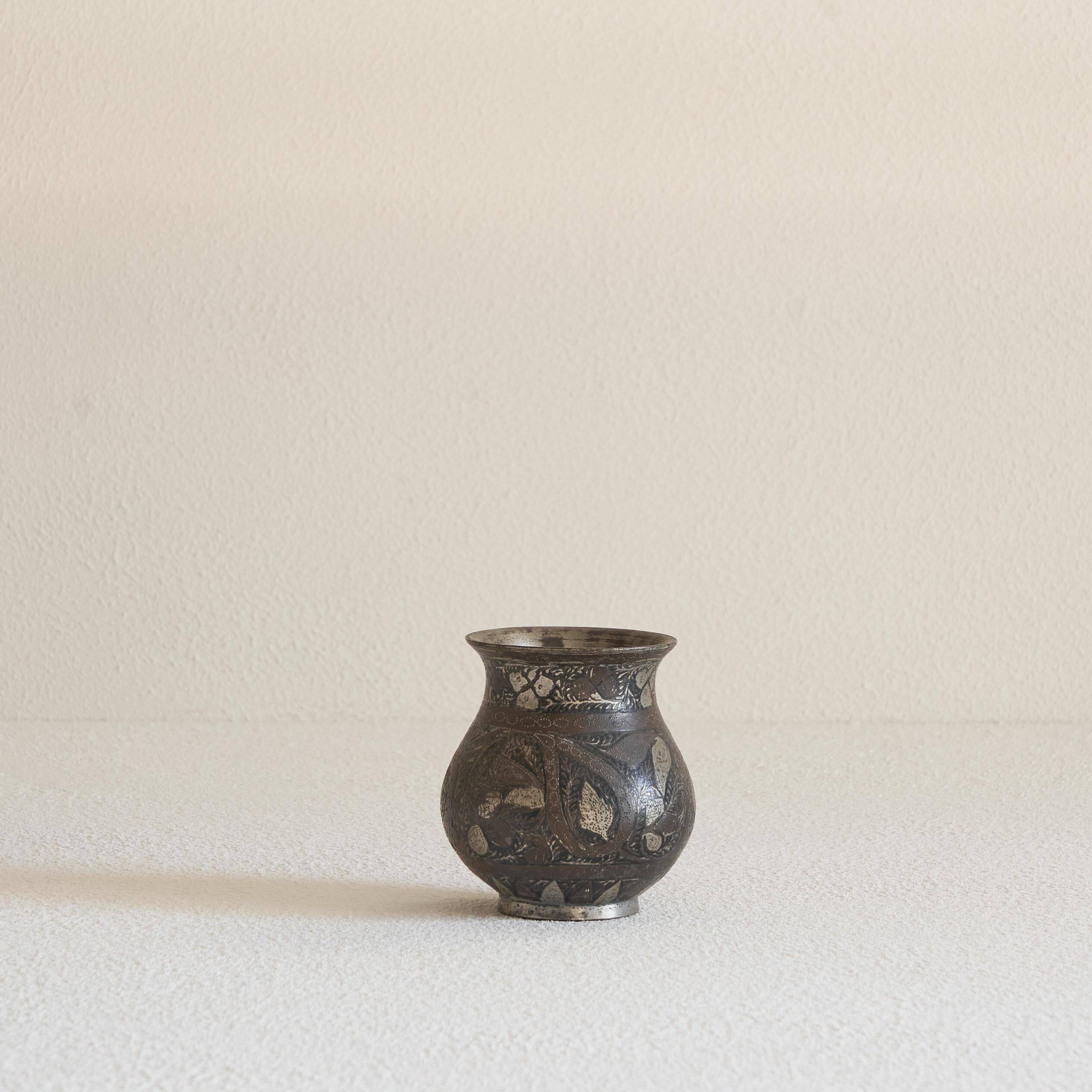 Antique pyriform Bidri vase in the shape of a pyramid.