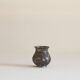 Antique pyriform Bidri vase in the shape of a pyramid.