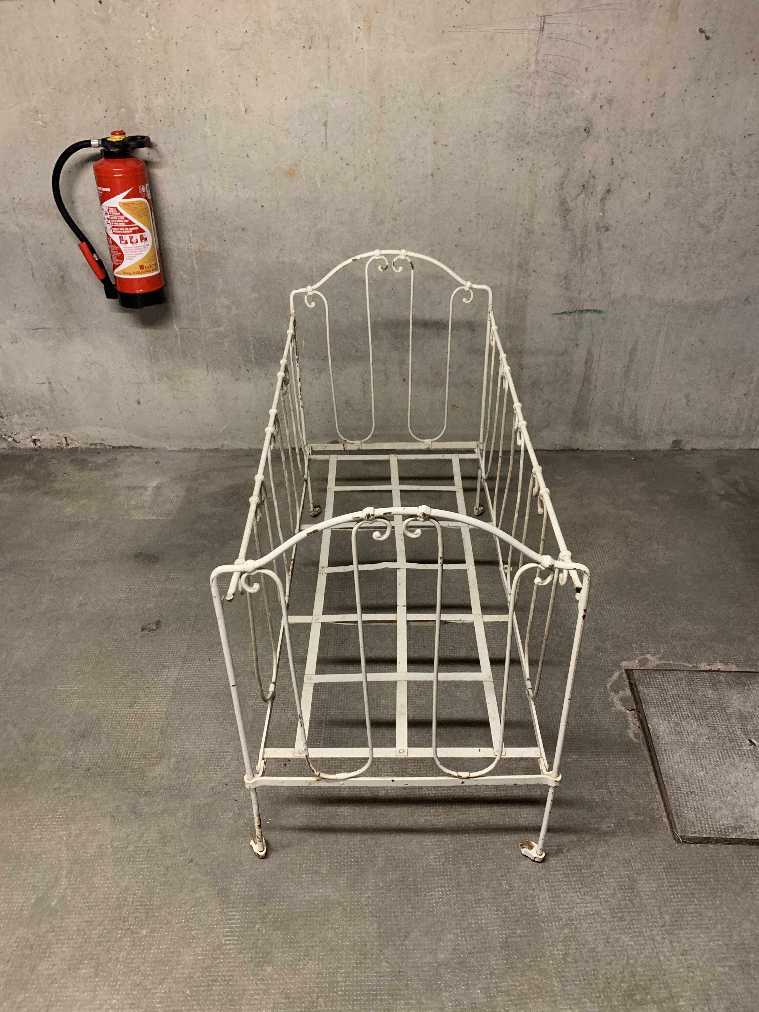 Old vintage wrought iron bench bed