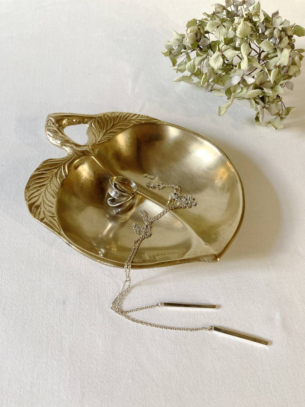 Brass catchall in the shape of an apple.