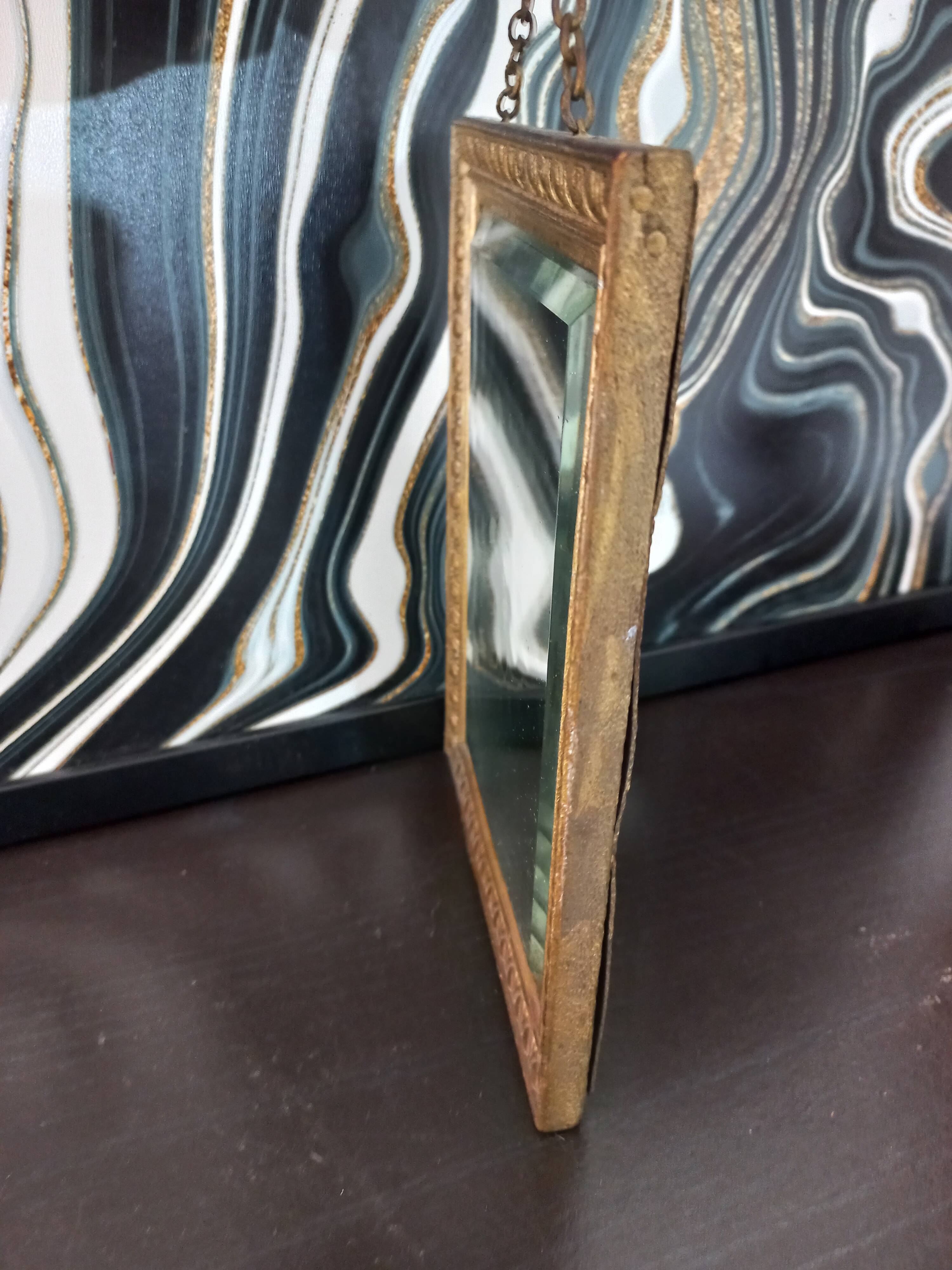 Small vintage mirror in gilded wood, bevelled glass with chain.