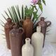 Old bottle in sandstone glossy with cove
