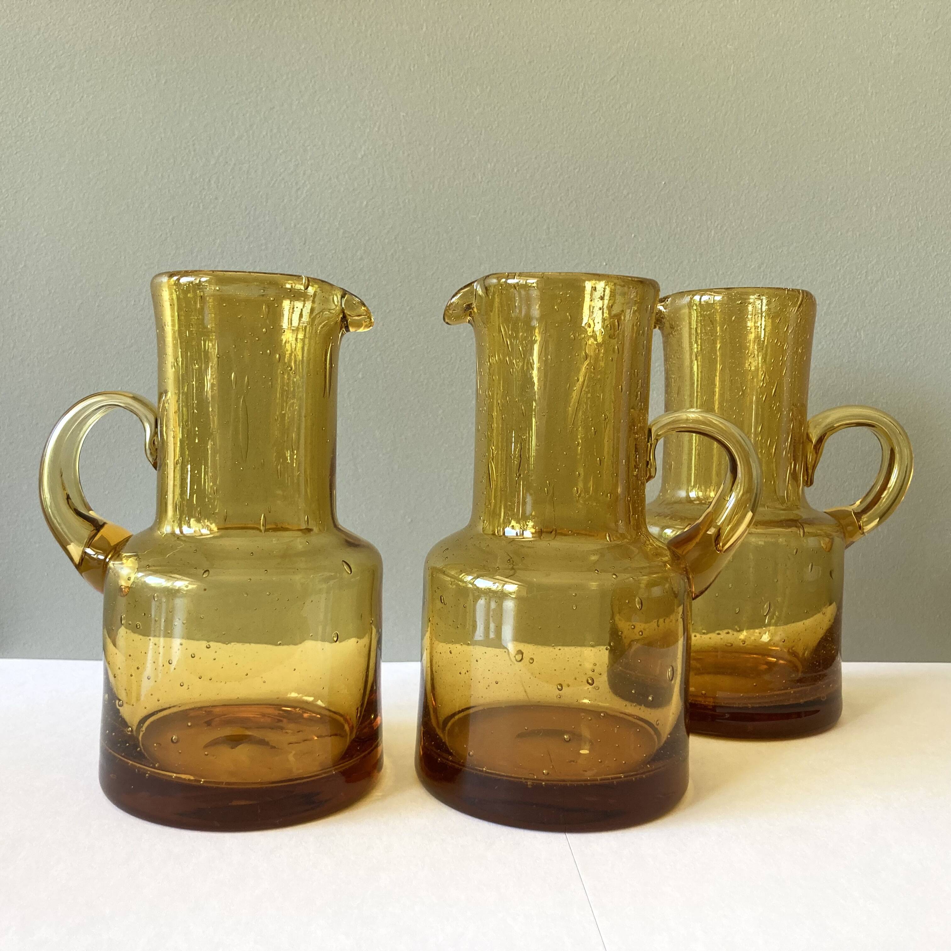 Vintage pitcher or jug forming a vase in amber and bubbled glass in the style of Biot glassware