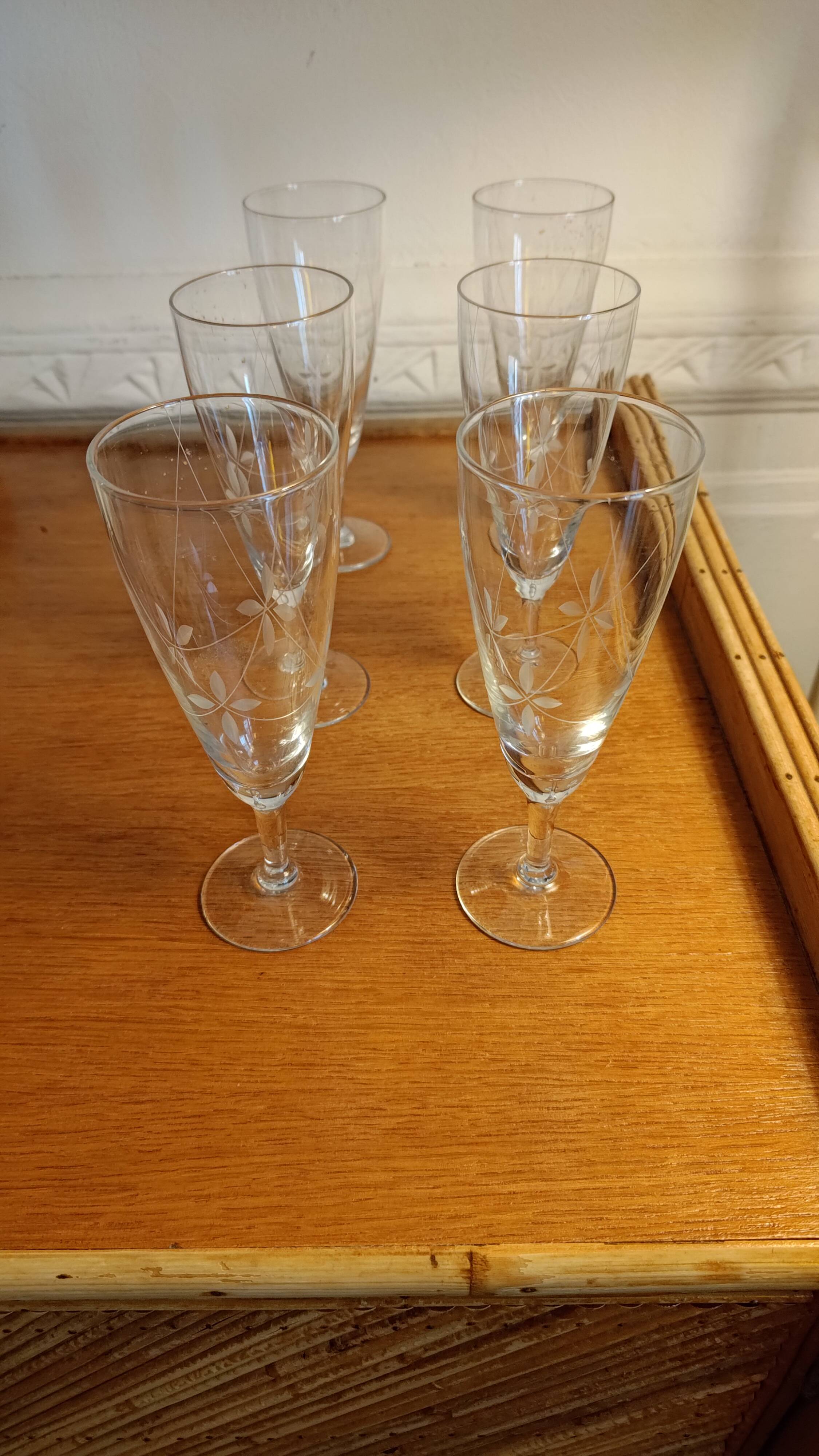 Six engraved crystal champagne flutes
