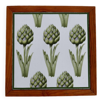 Vintage wood and earthenware trivet with artichoke pattern