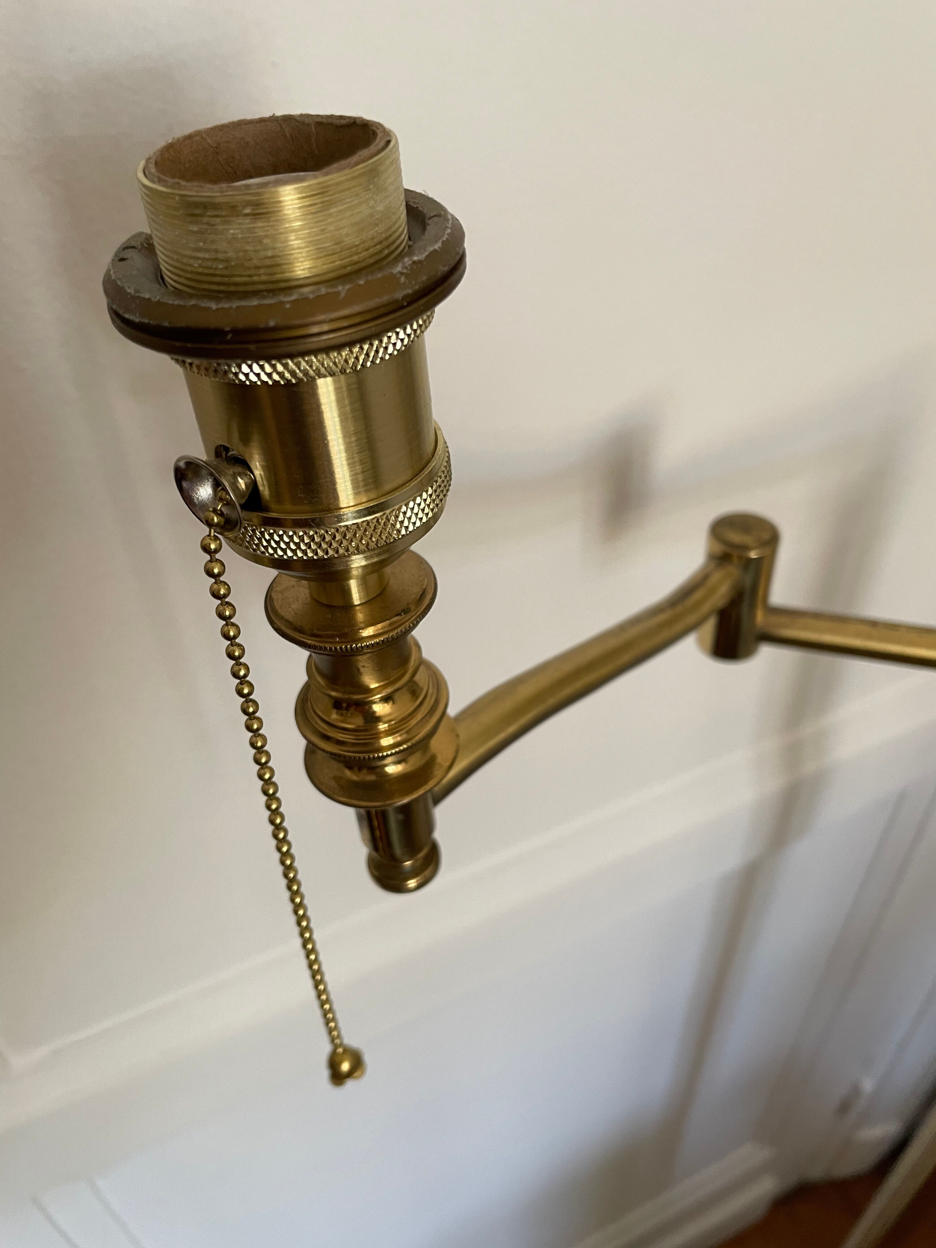 Articulated brass and gold metal floor lamp