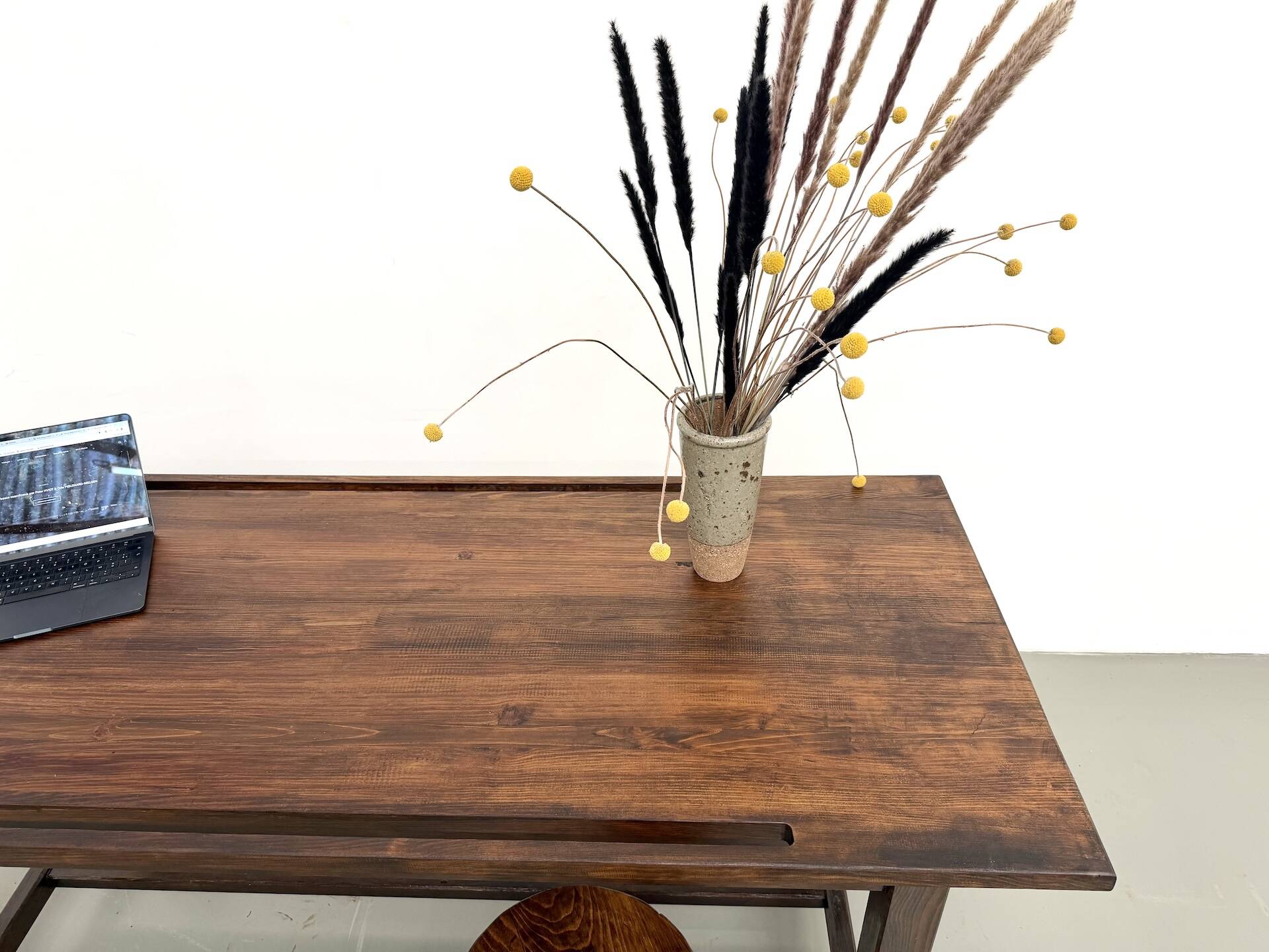 Solid pine workbench, grooved top, satin brown finish.