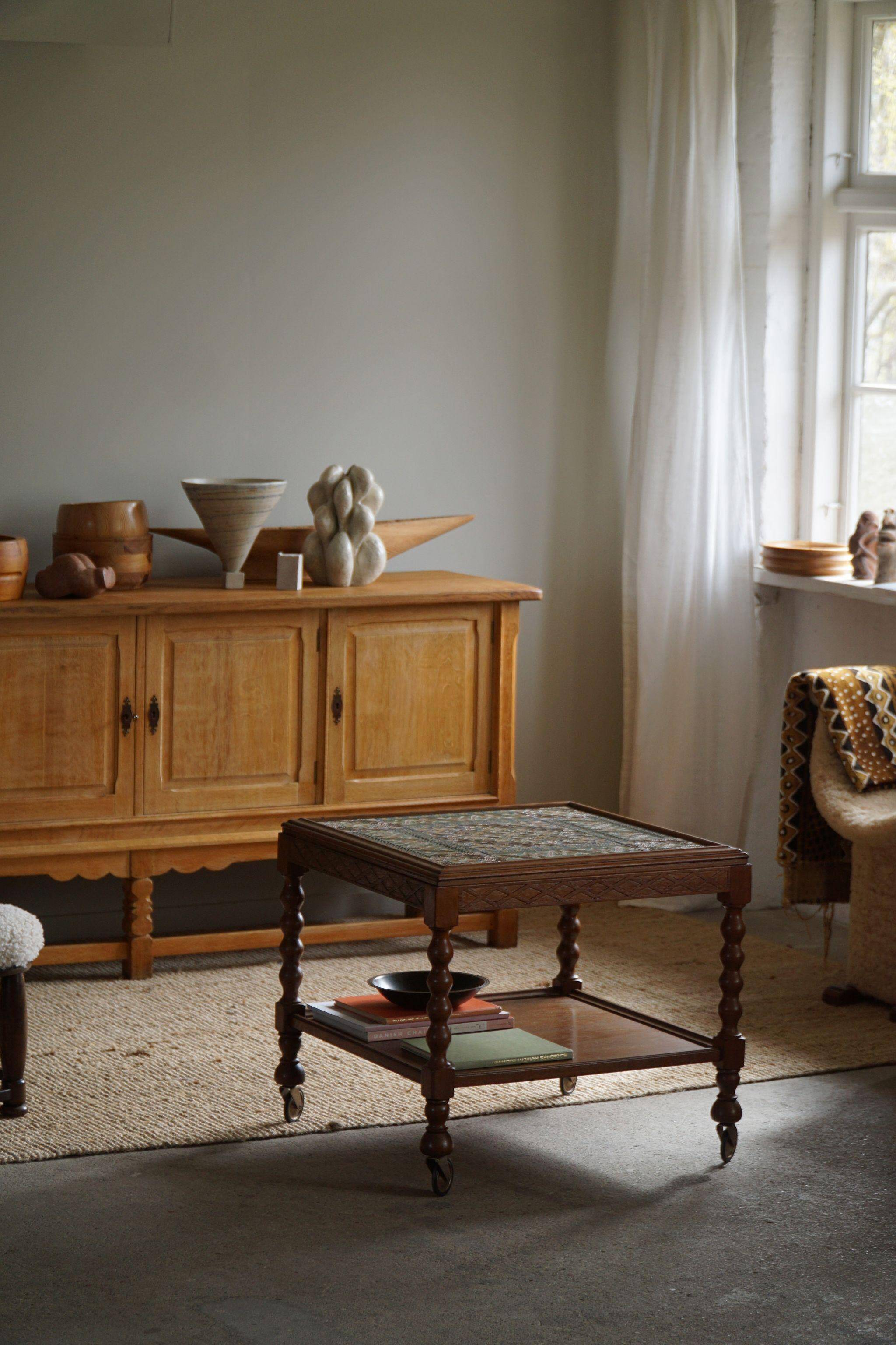 Modern Danish service table with turned spool legs and coloured tiles, 1950s.