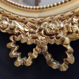 Louis XVI mirror in gold resin decorated with knots 44x62cm
