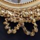 Louis XVI mirror in gold resin decorated with knots 44x62cm