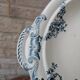 Shallow round plate Boch Frères model Regent with arabesque and foliage decoration.