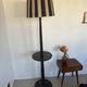 Vintage floor lamp in black patinated wood and striped lampshade