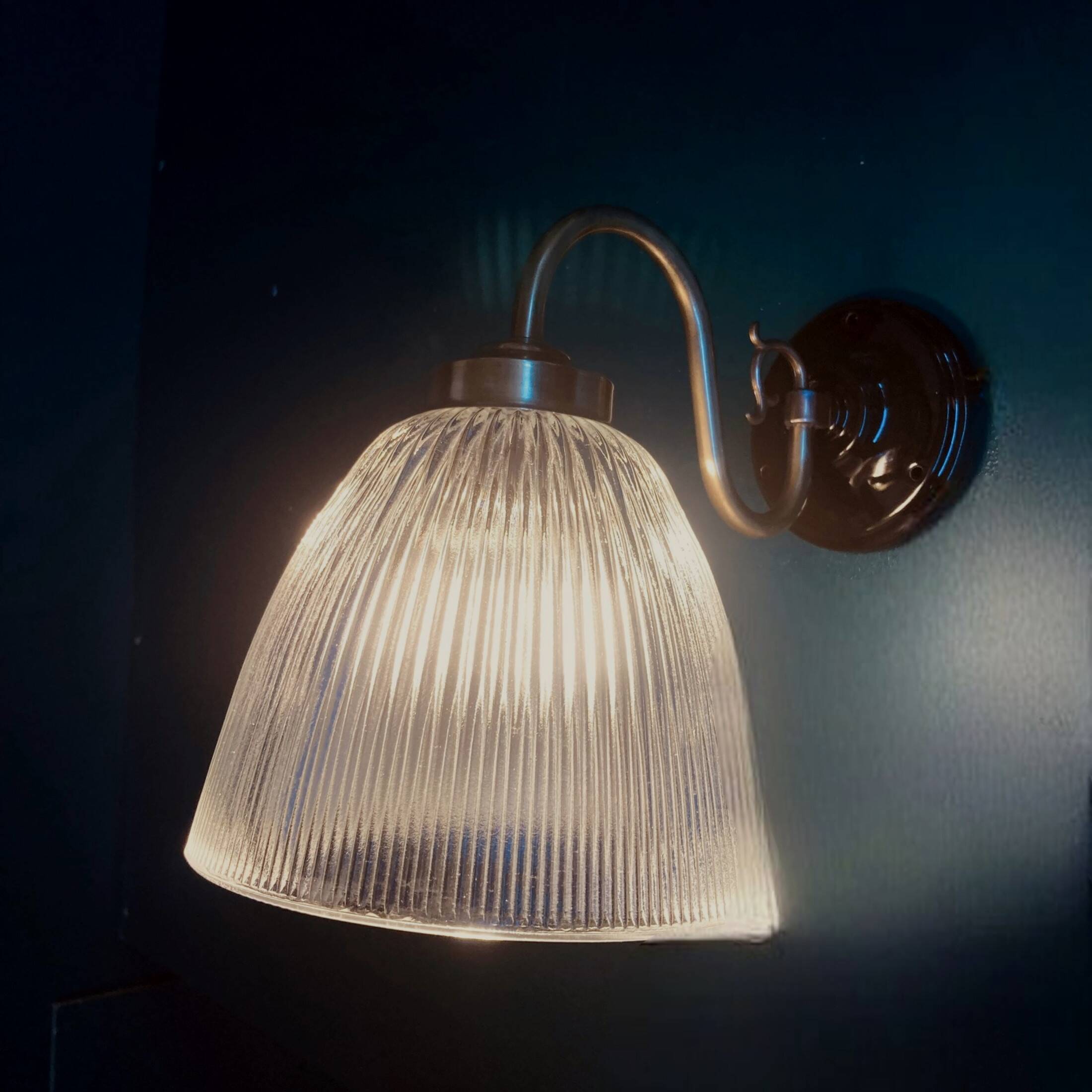 Brass swan neck wall light and prismatic glass tulip vintage porcelain rosette