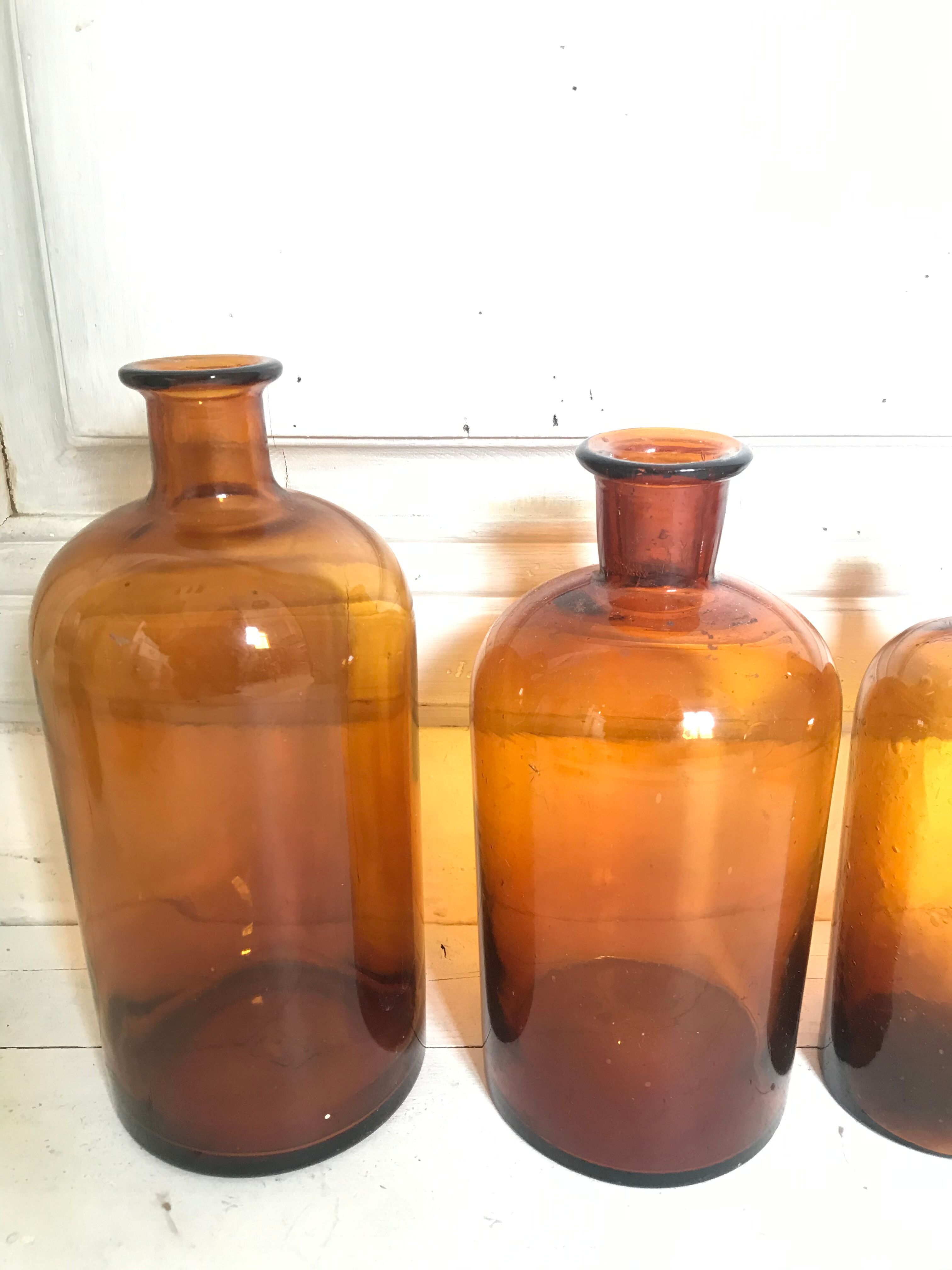 Trio of apothecary bottles