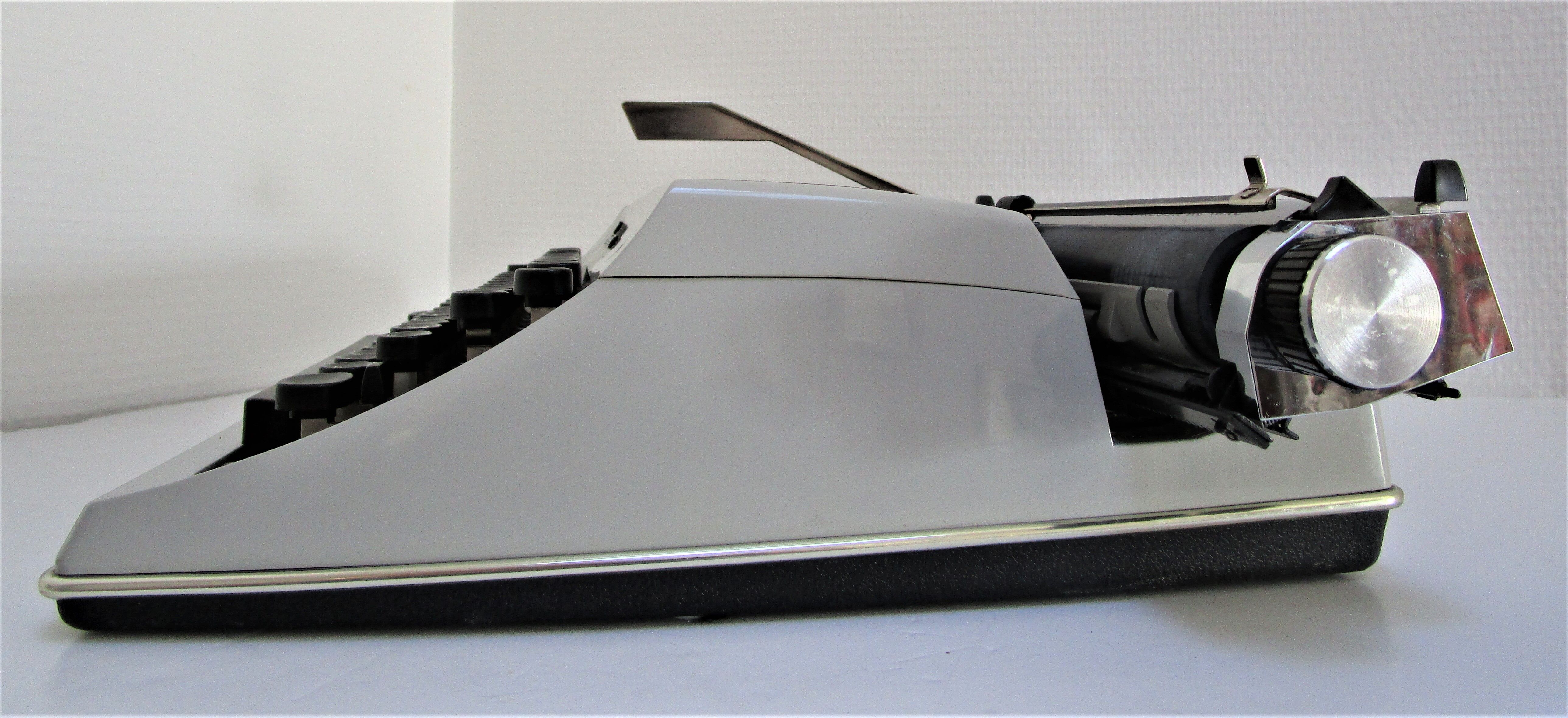 Writers' typewriters of light grey 70s Adler made in Holland