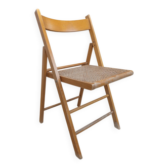 Vintage folding chair with caning.