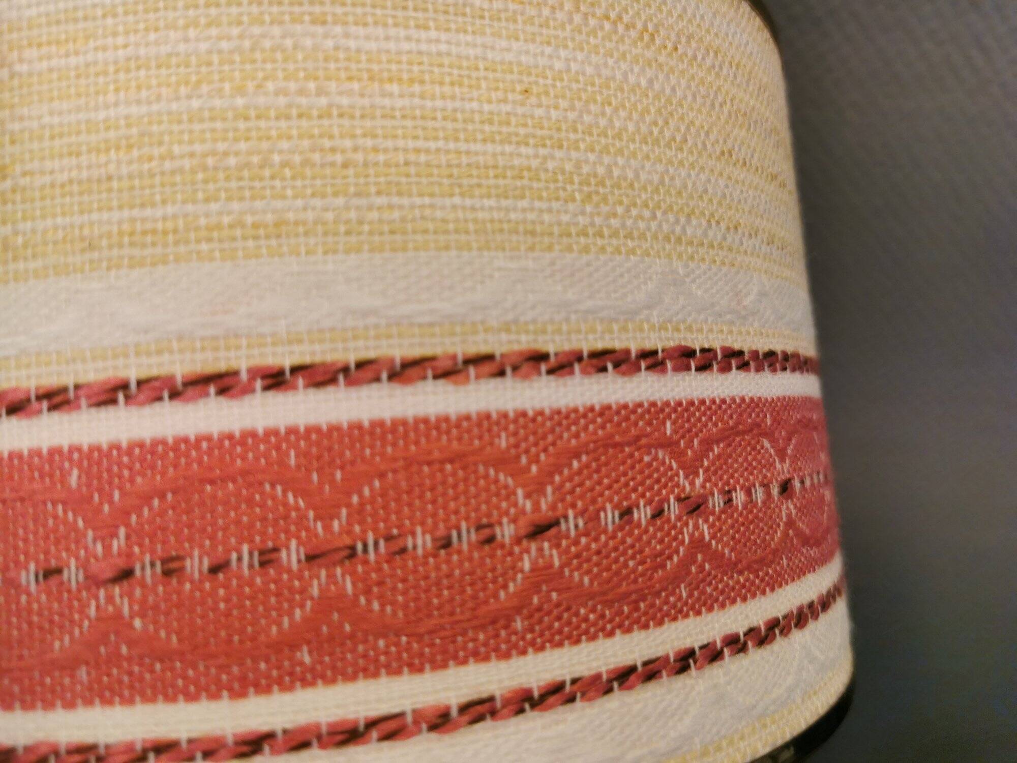 Hanging lamp with brass-coloured details, made of fabric with intact plastic bottom grille.