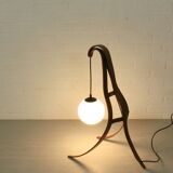 Sculptural table lamp with globe