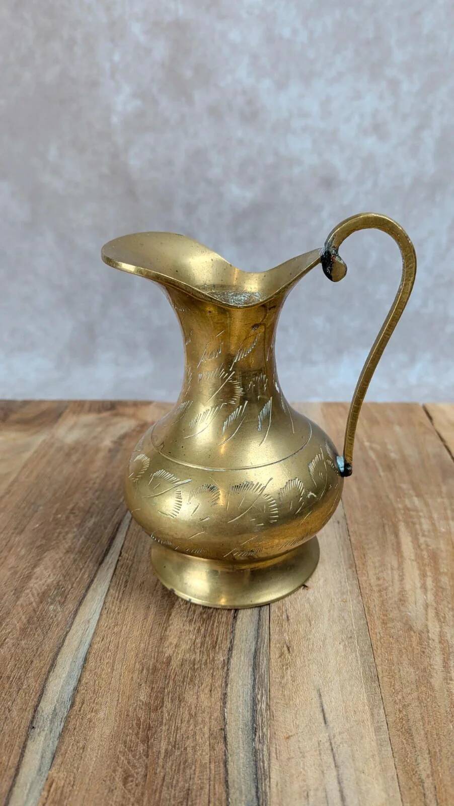 Small antique engraved brass jug