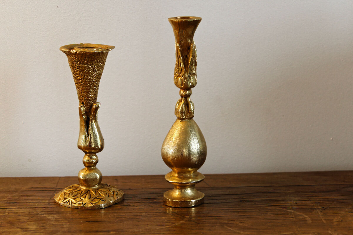 Pair of handmade candle holders, cast iron