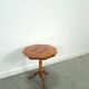 Round vintage wooden side table with inlaid veneer