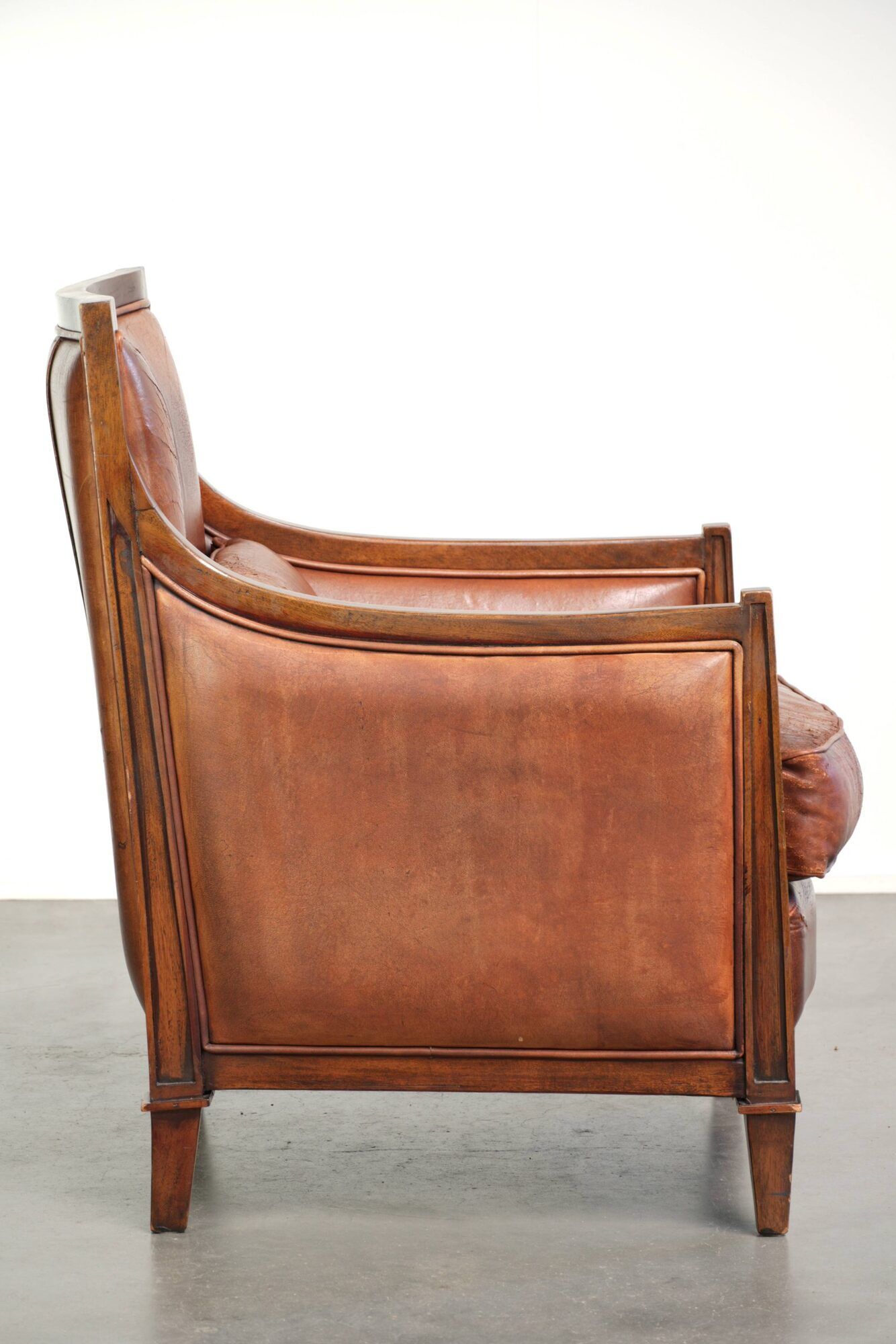 Sheepskin Art Deco design armchair with a comfortable seat and warm colours