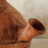 Antique oriental clay pitcher.