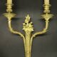 Pair of large wall sconces with flowers in the Louis XVI style from the 19th century - gilded bronze.