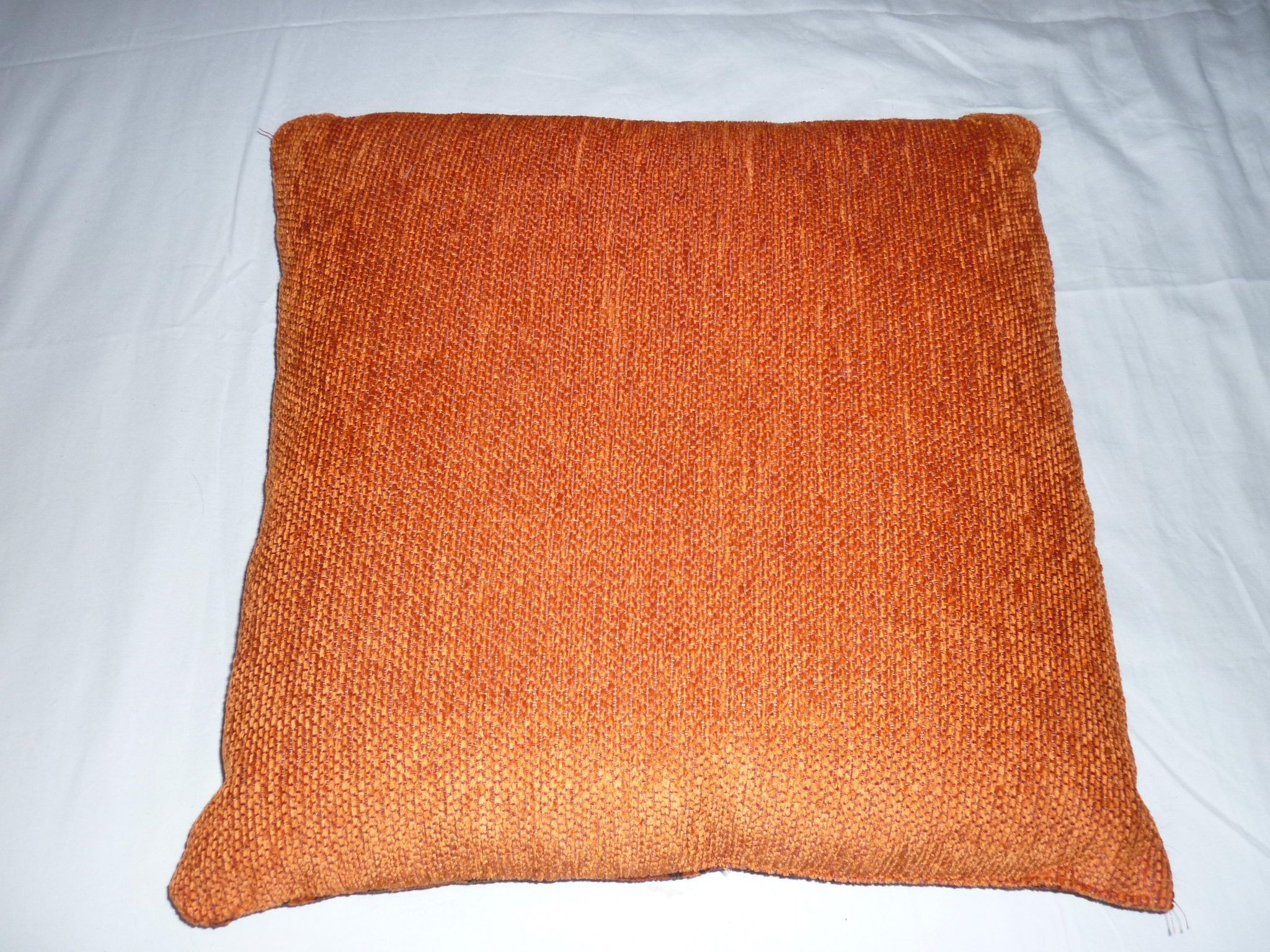 Large orange velvet cushion