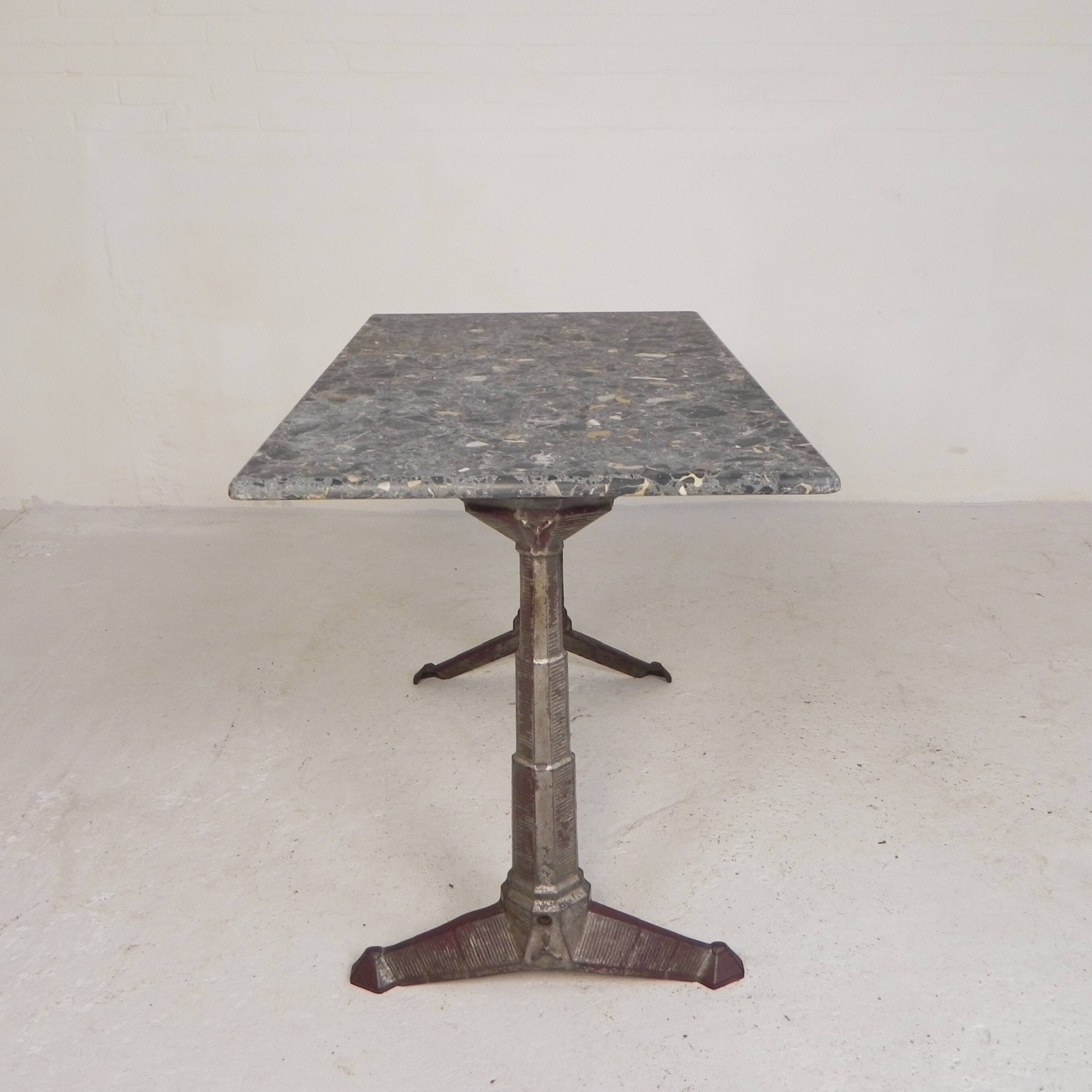 Bistro table with a marble top on a cast iron frame, 1930s.